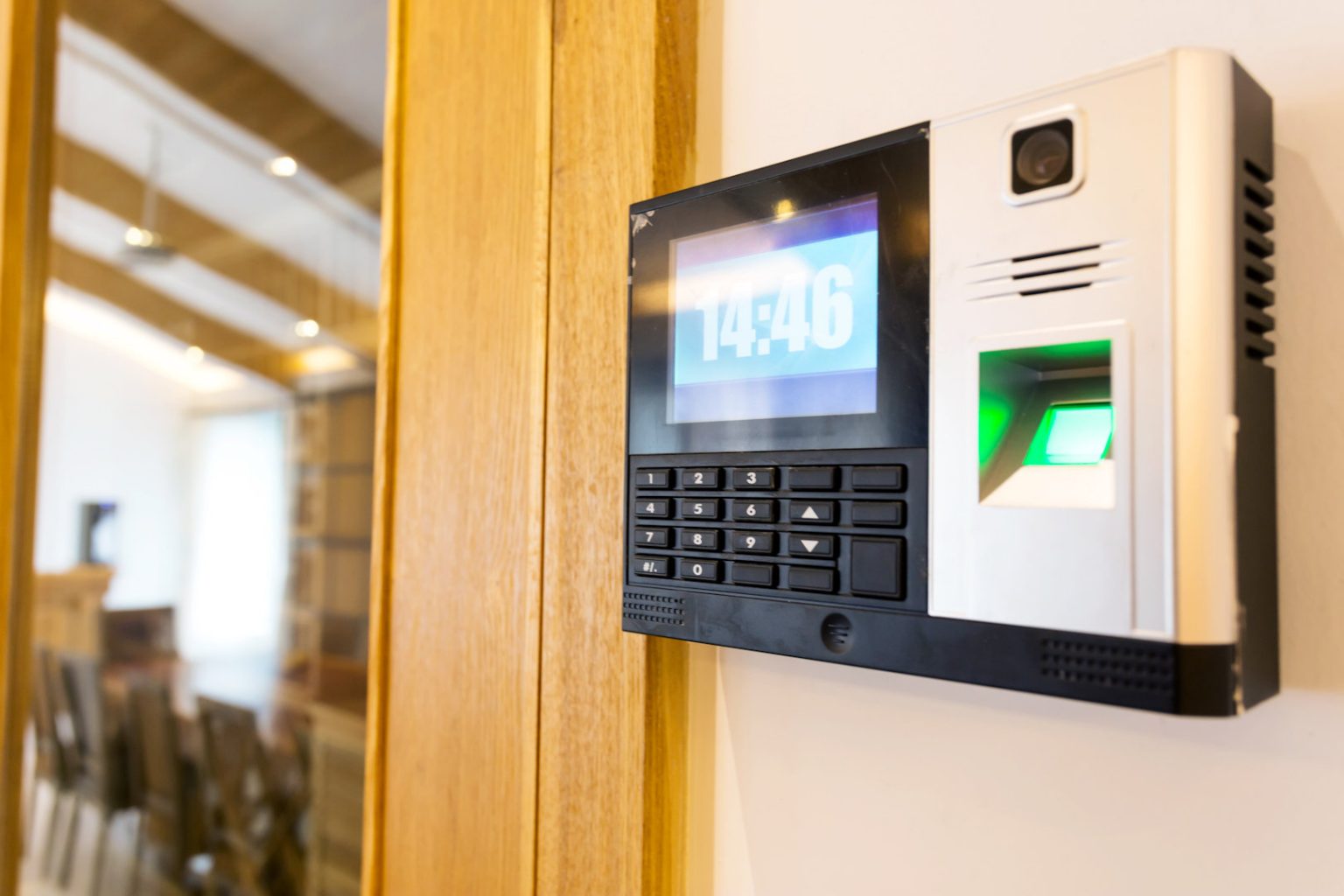 biometric fingerprint reader mounted on office wall
