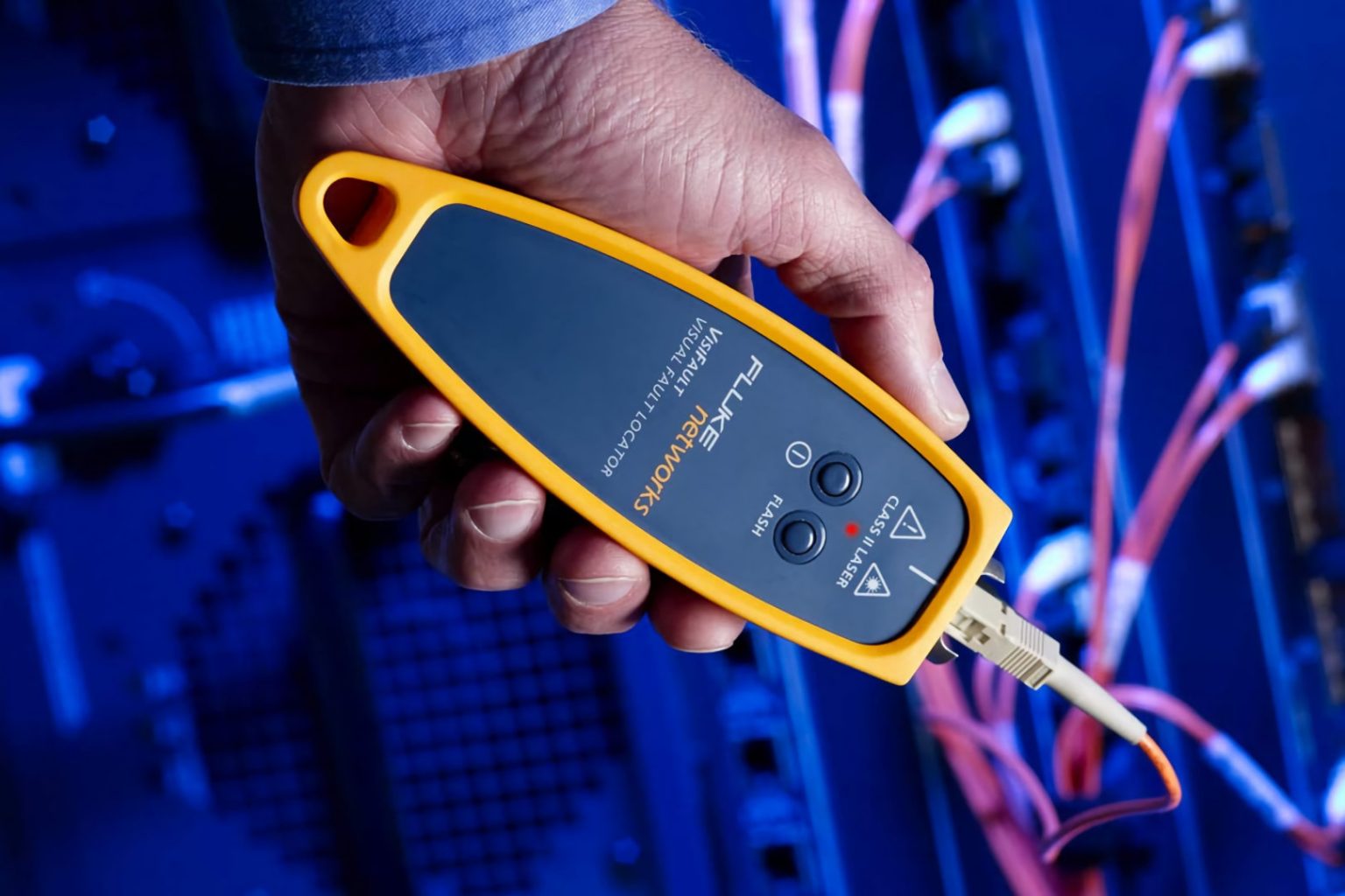 microngroup technician using fluke network data cable tester for testing data cables