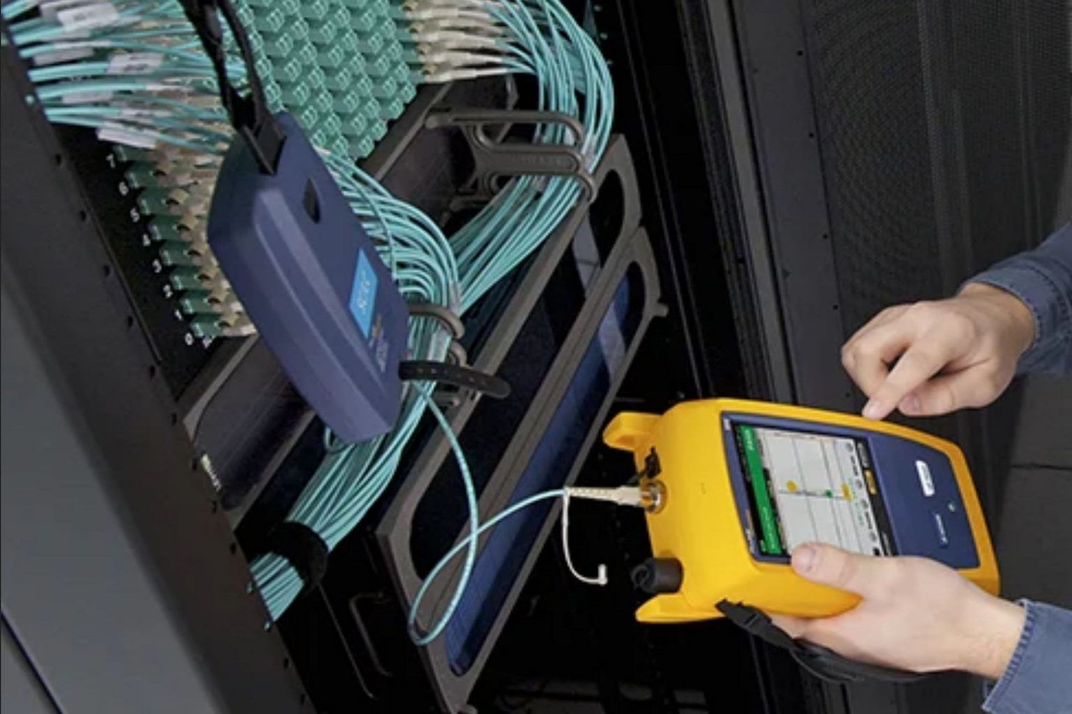 microngroup technician using fluke network cable tester for testing data cables